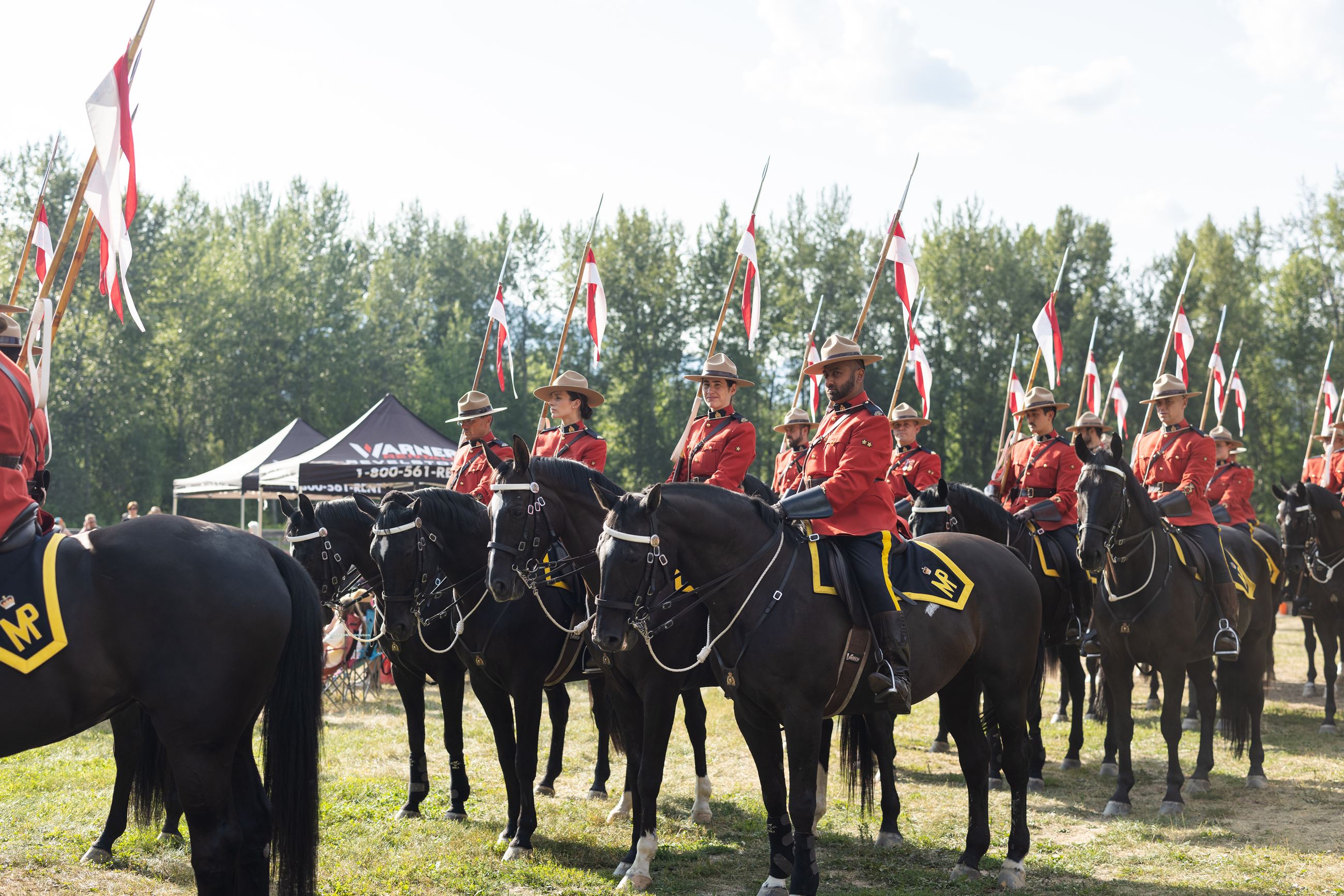 Royal Canadian Mounted Police Officers on Horseback at a Community Event